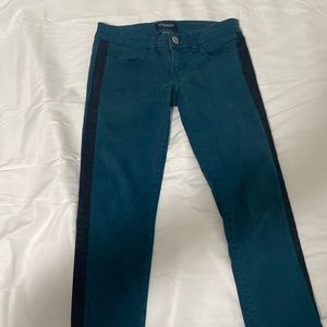 low rise teal skinny jeans with balck stripe